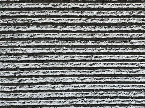 Mineralni zaključni omet za izvedbo modernih ali zgodovinskih vzorcev na fasadni površini.